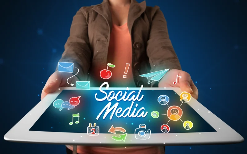 casual-young-woman-holding-tablet-with-social-medi-2025-10-13-13-18-33-utc