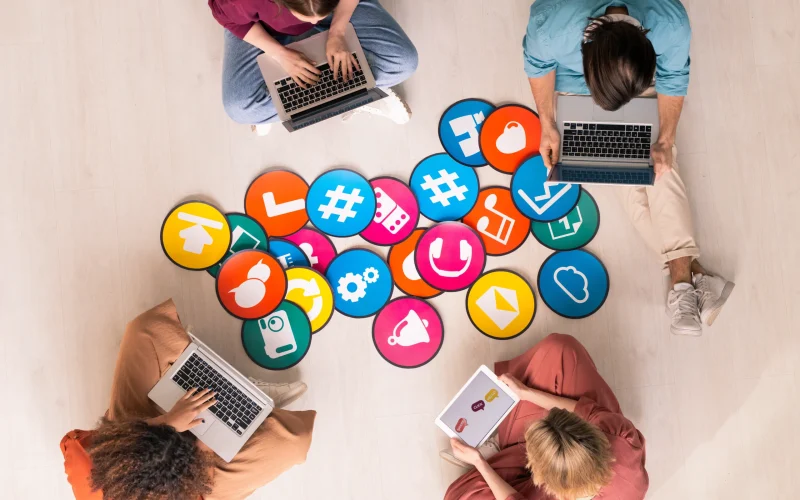 young-friendly-people-in-casualwear-sitting-by-mul-2025-03-14-15-44-51-utc